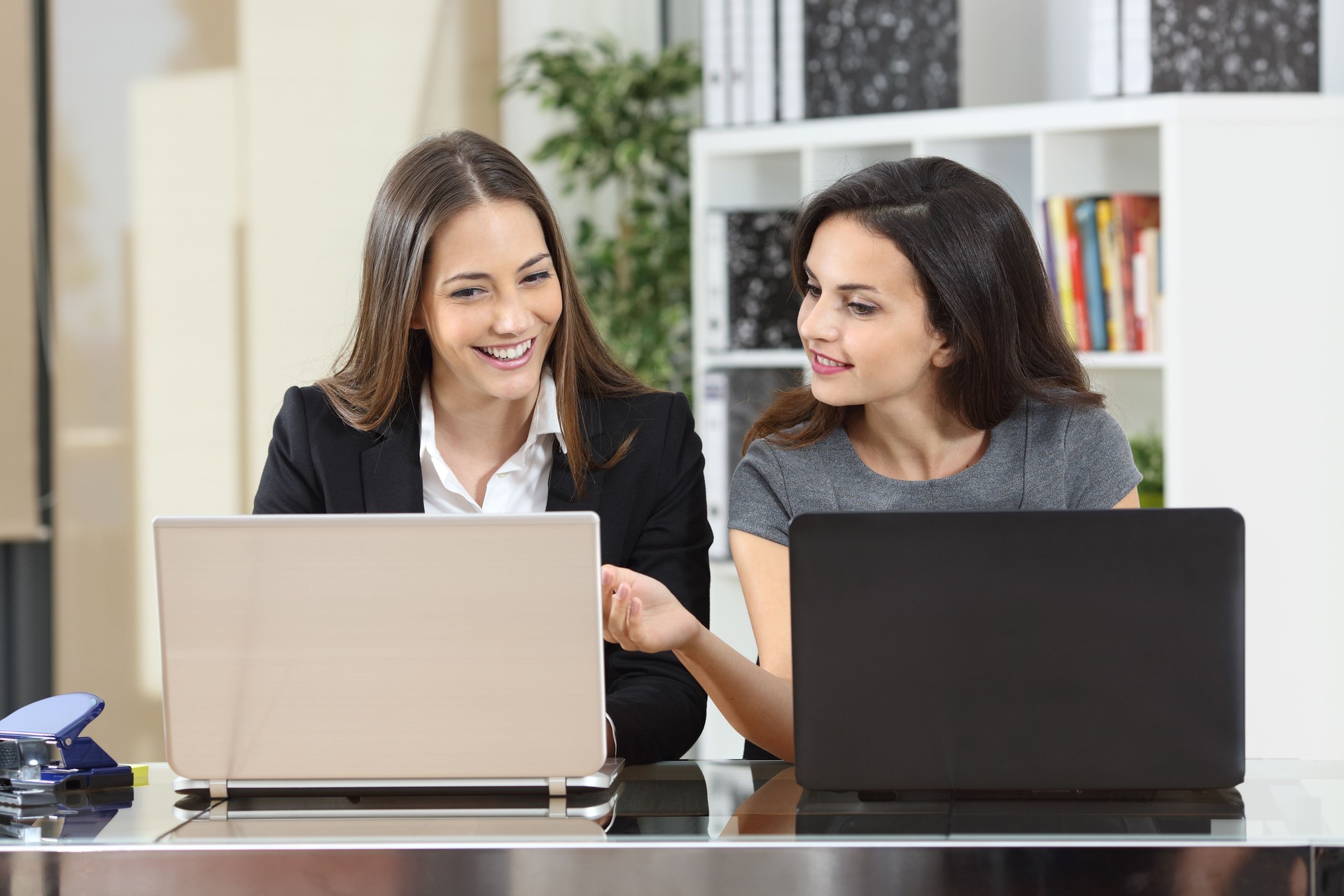 Businesswoman helping to her colleague at office